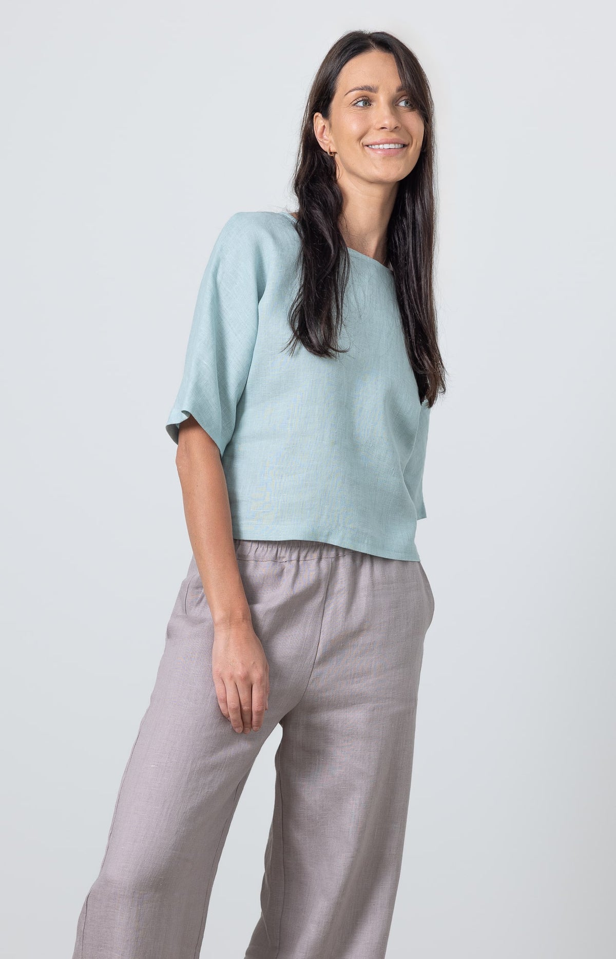 Women's linen cropped blouse in pastel blue paired with wide leg linen pants