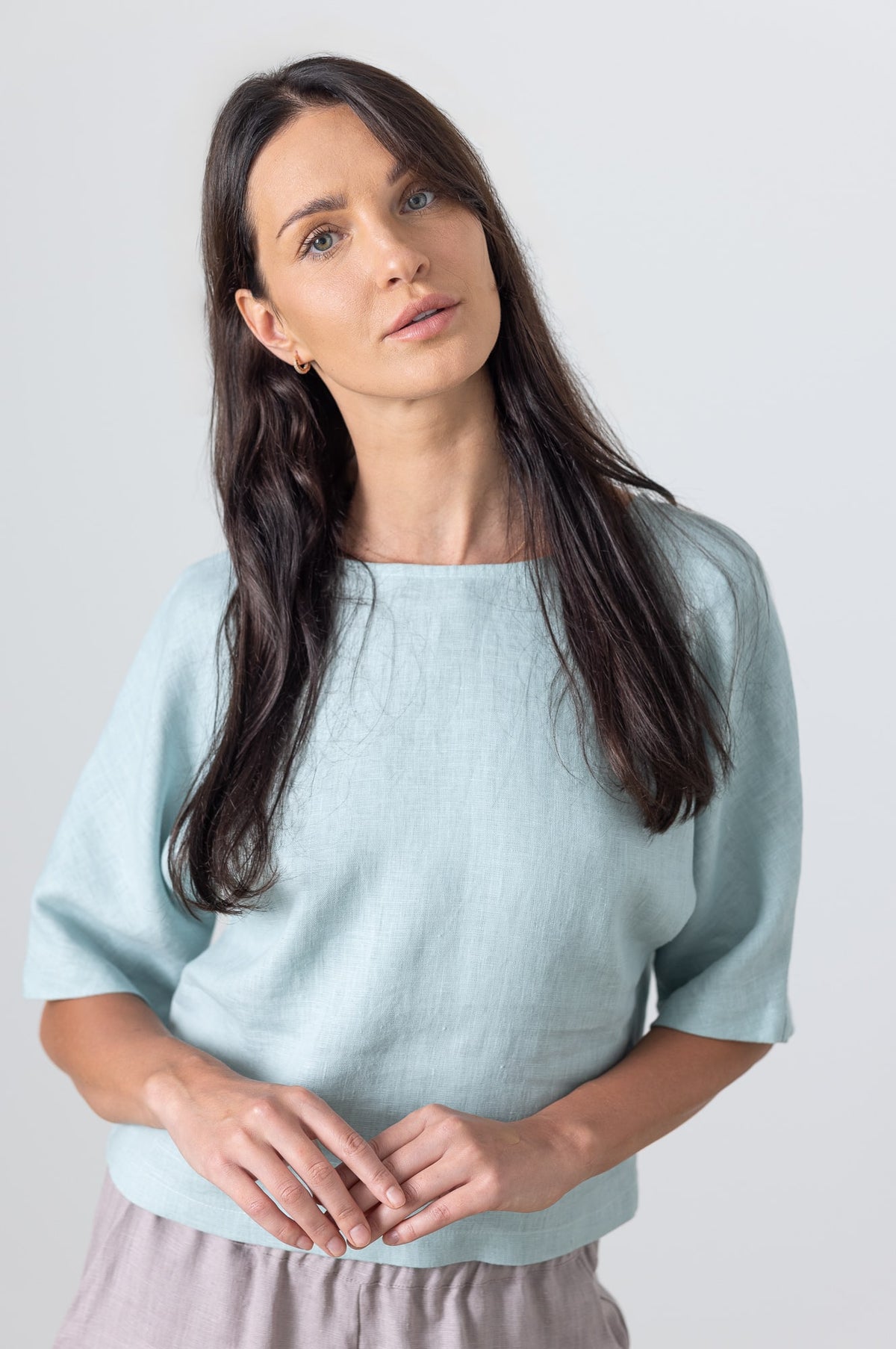 Close-up of light blue linen crop top for women – minimal fashion detail