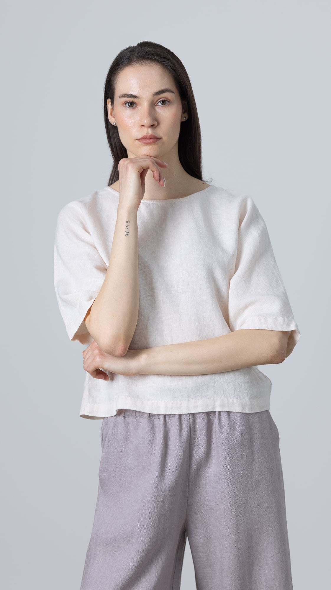 Relaxed white linen blouse Molly, cropped women’s linen shirt styled with wide-leg trousers for effortless look