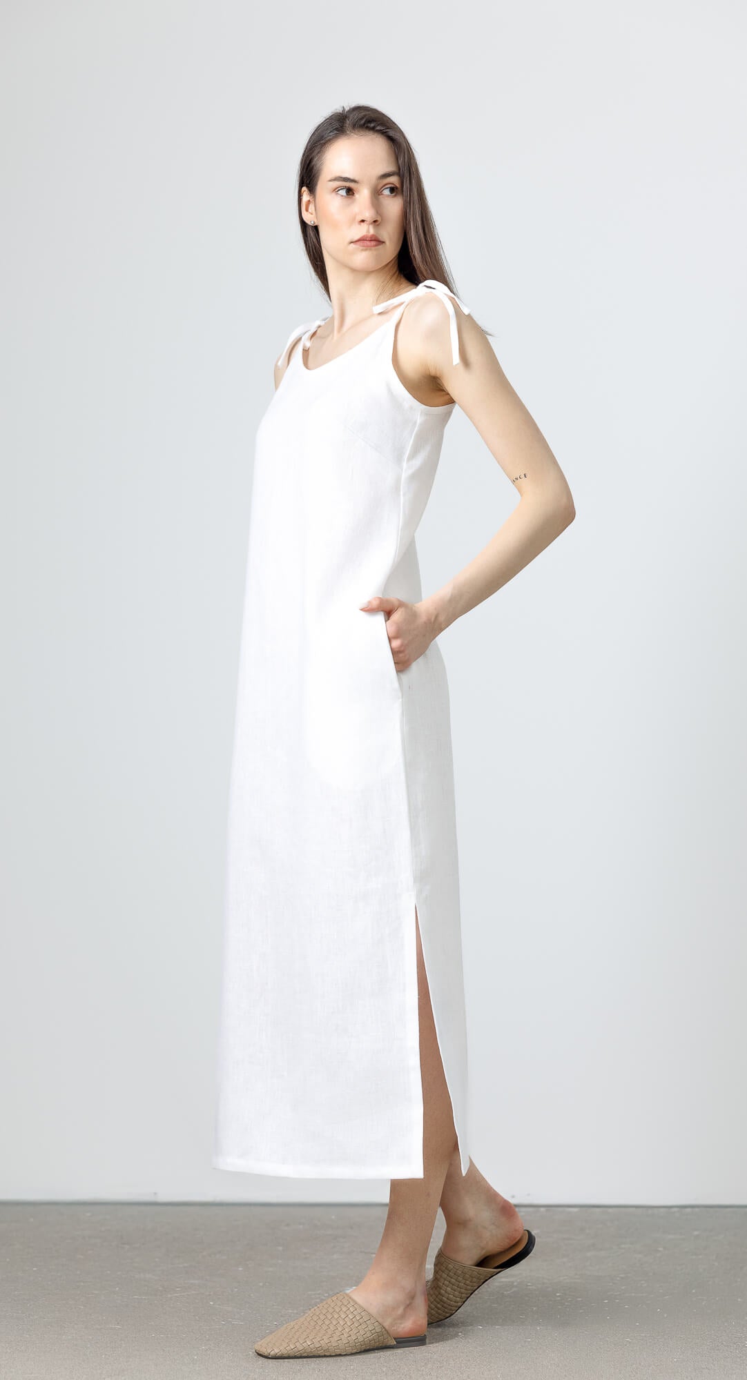 Sustainable white linen summer dress with relaxed straight silhouette