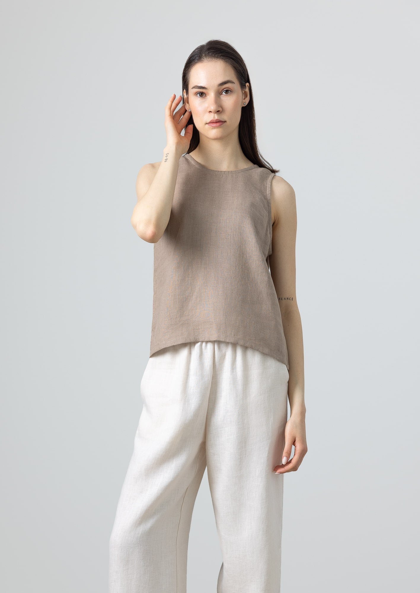 Sleeveless minimalist linen top in earthy brown shade