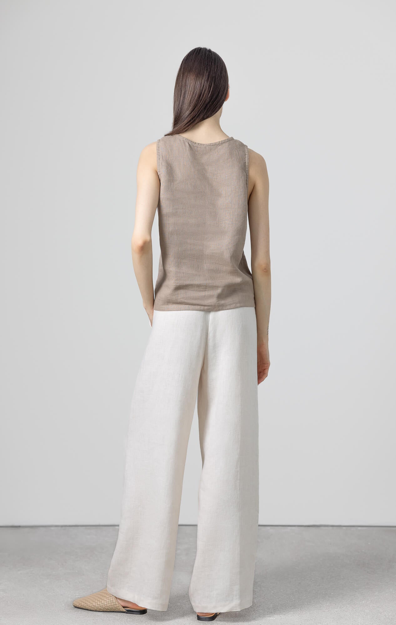 Minimalist brown linen top made from breathable flax fabric.
