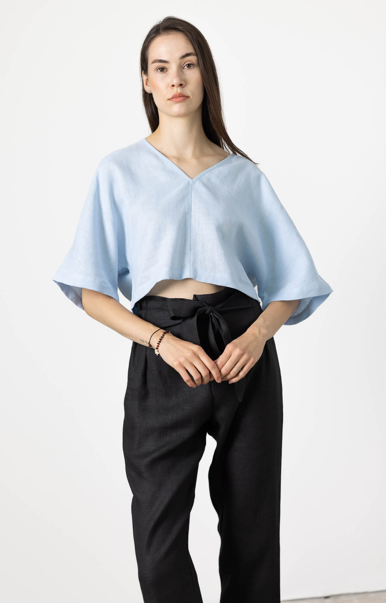 Minimalist women linen blouse in soft blue color
