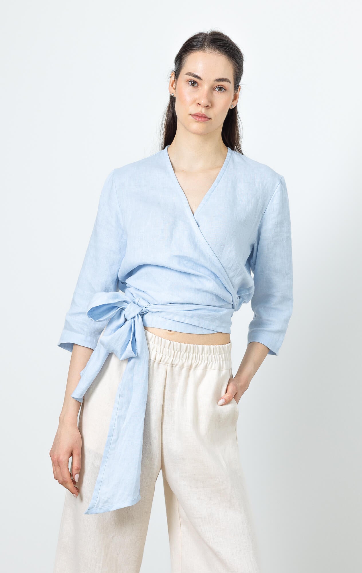 Women’s linen wrap blouse in soft blue with elegant relaxed fit