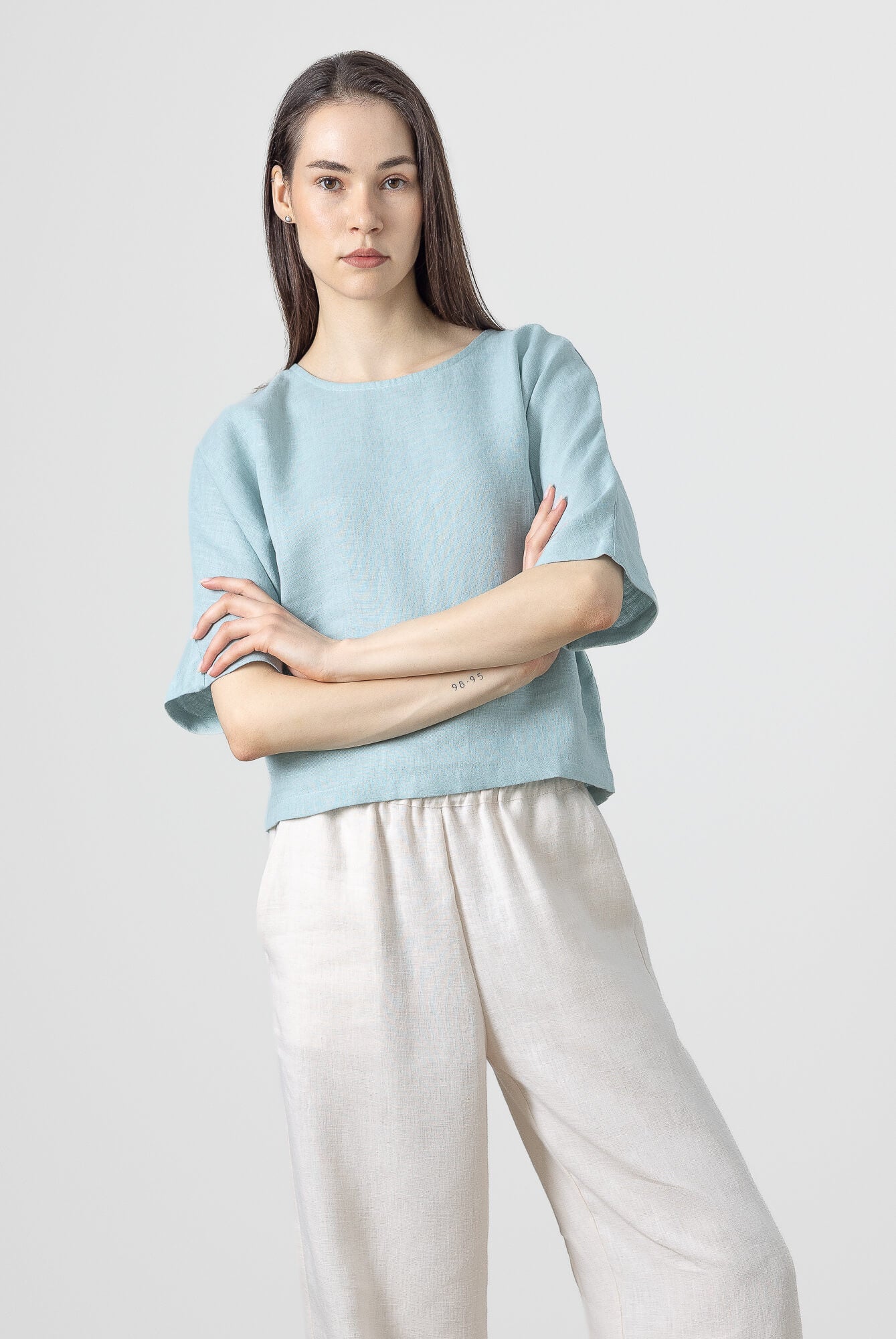 Cropped linen top featuring a minimalist relaxed silhouette