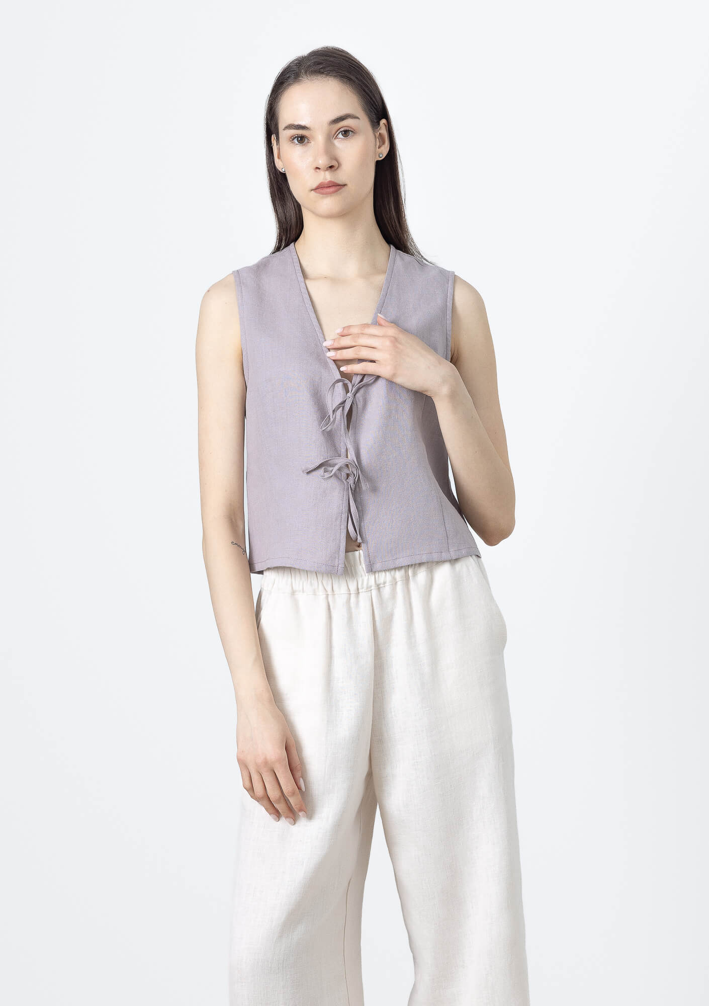 Women's linen tie front vest with sleeveless V-neck design and front bow closure