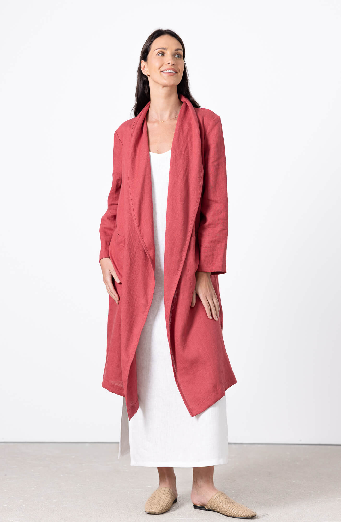 elegant woman in red linen cardigan long coat minimalist fashion look