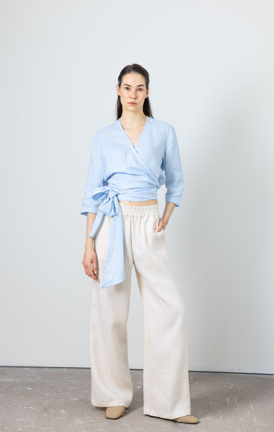 Elegant blue linen wrap top with wide tie detail – feminine and timeless summer look