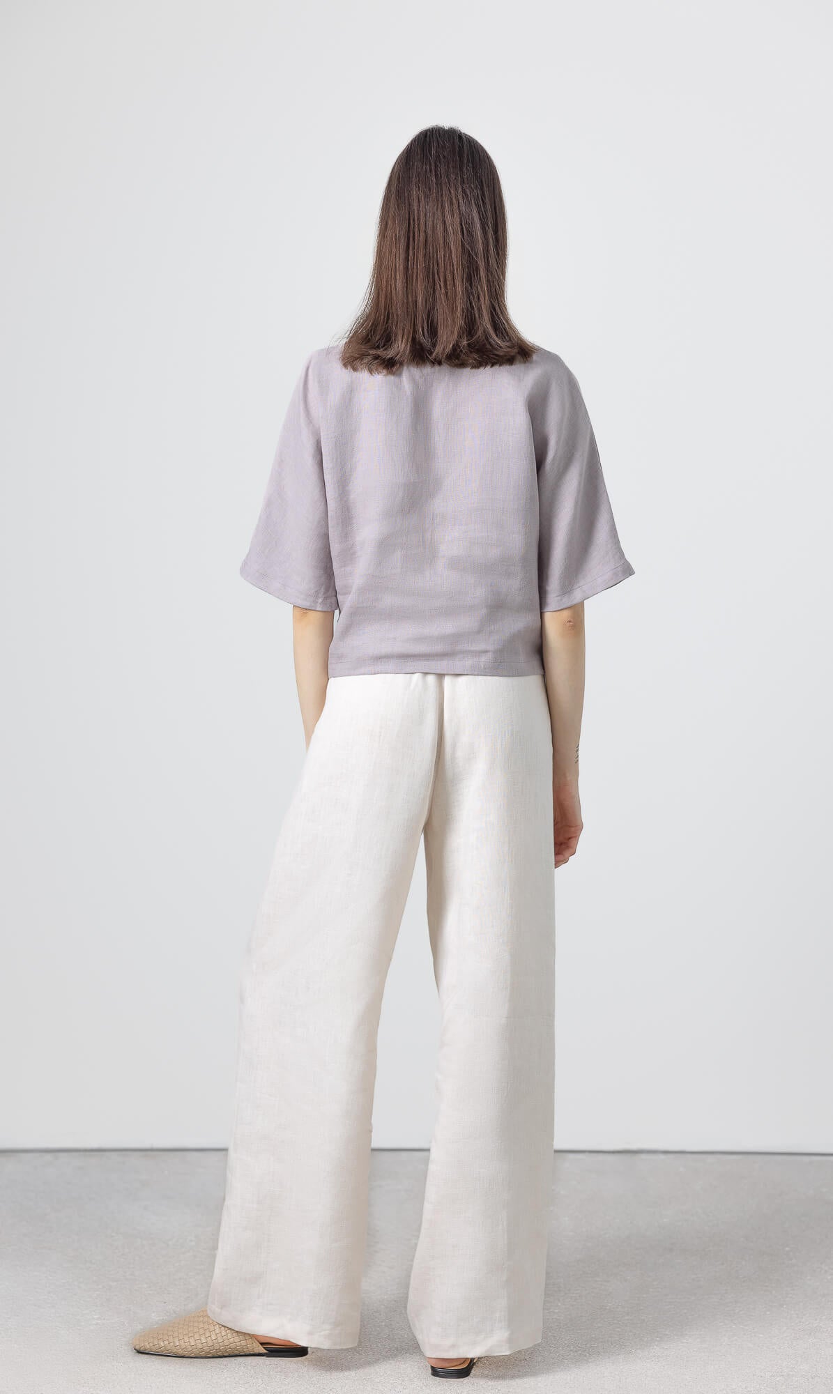 Minimalist women's linen crop blouse crafted from breathable natural linen with a relaxed silhouette