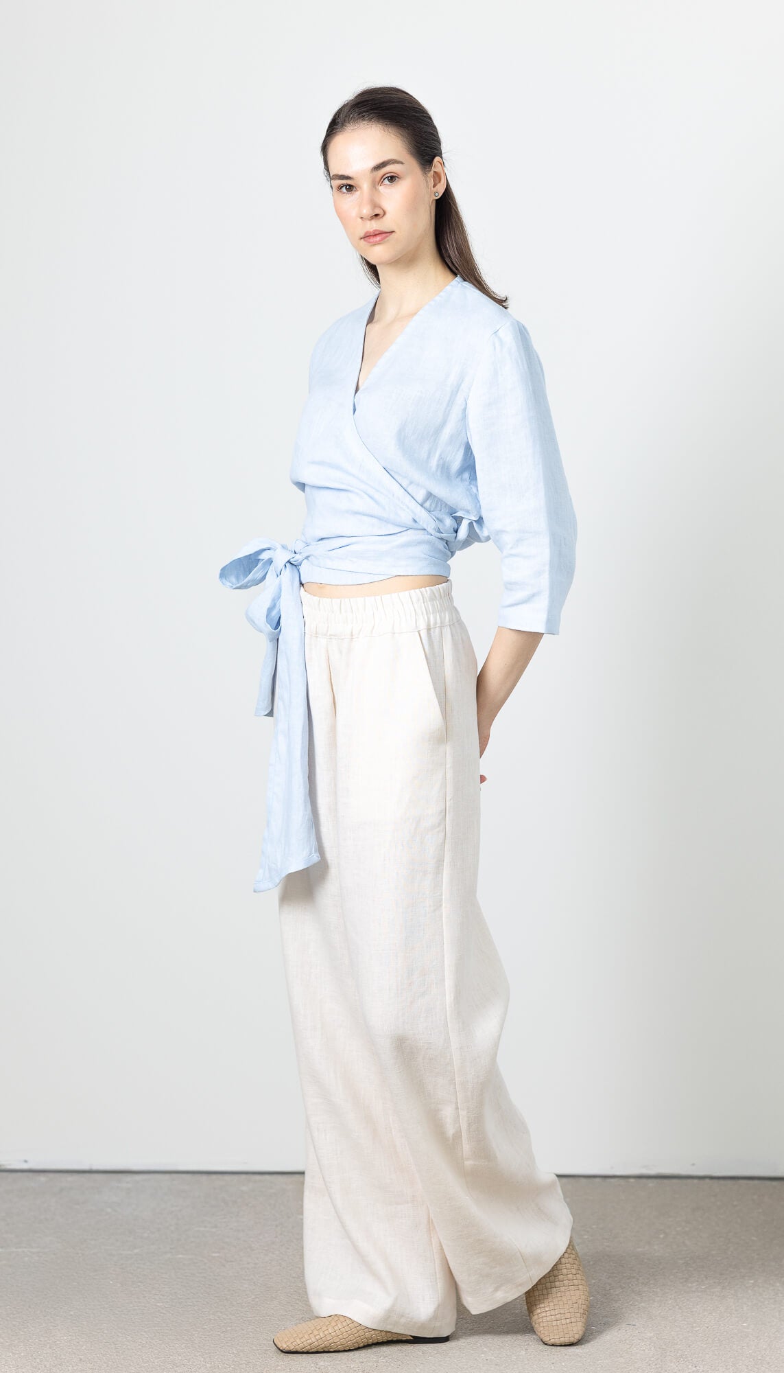Sustainable linen wrap top in pastel blue for modern minimalist outfits