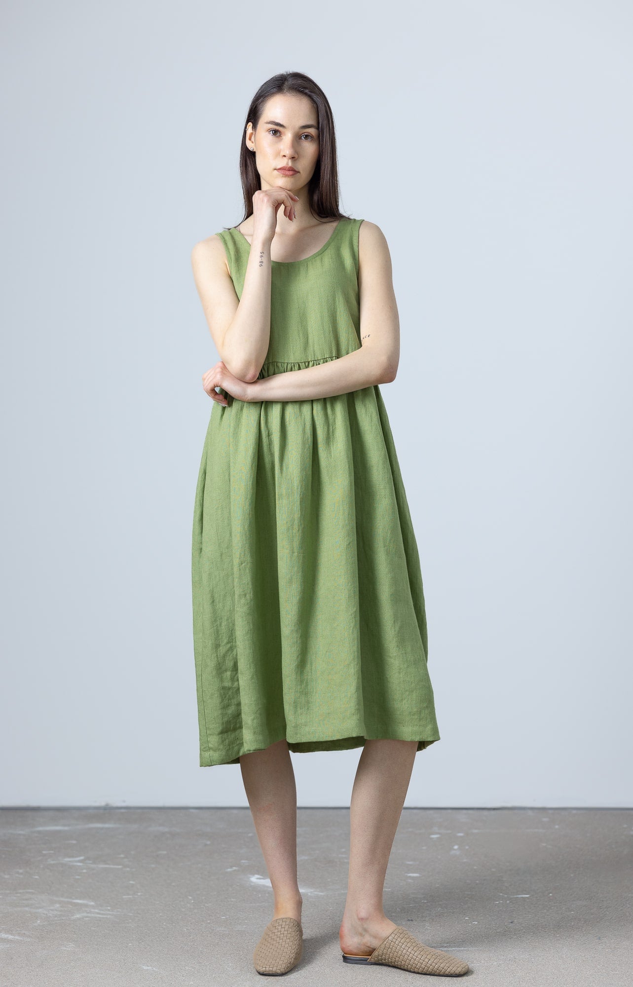 MinimalisticLinen green linen dress women, a casual sleeveless style with a gathered waistline.