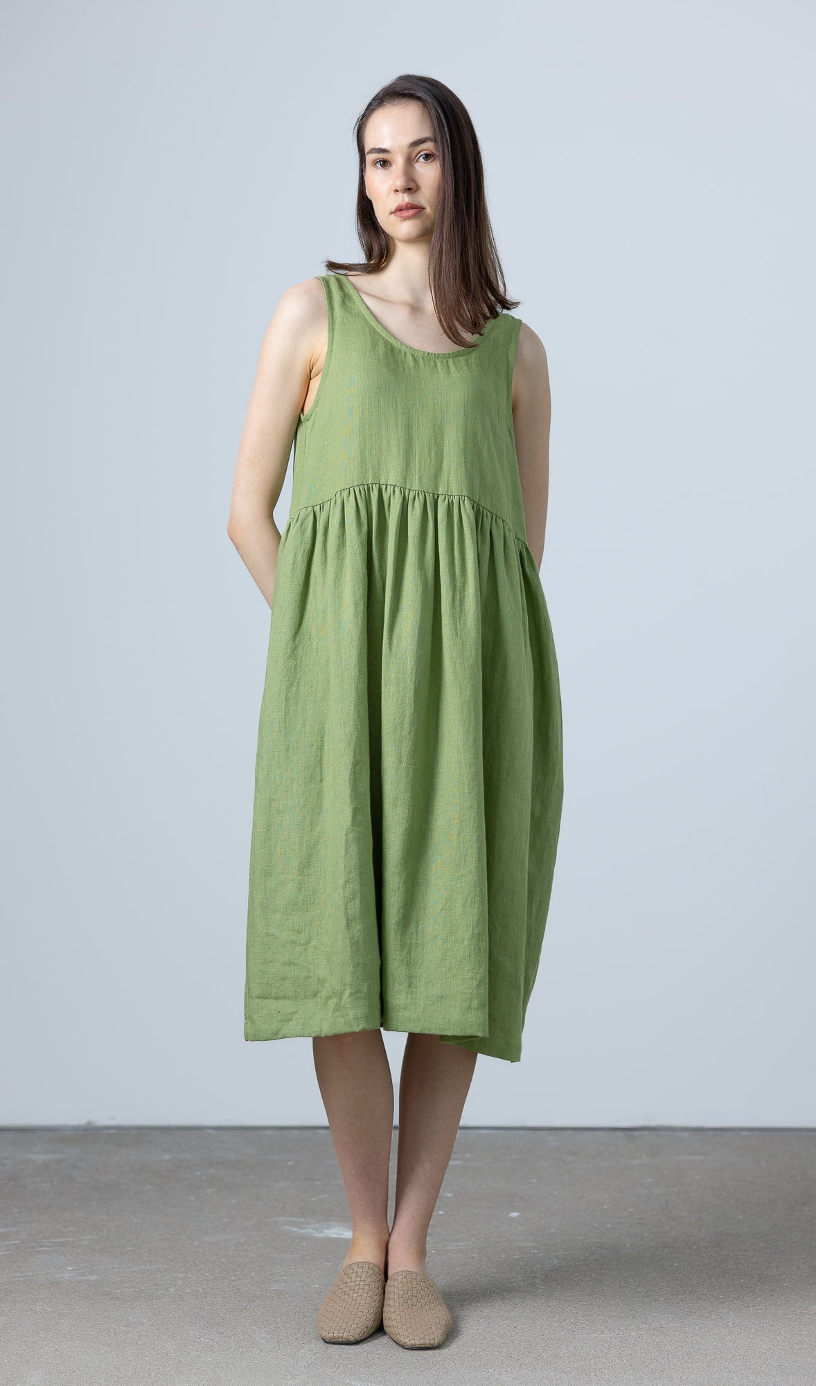 MinimalisticLinen green linen midi dress styled simply, highlighting its easy fit and breathable fabric