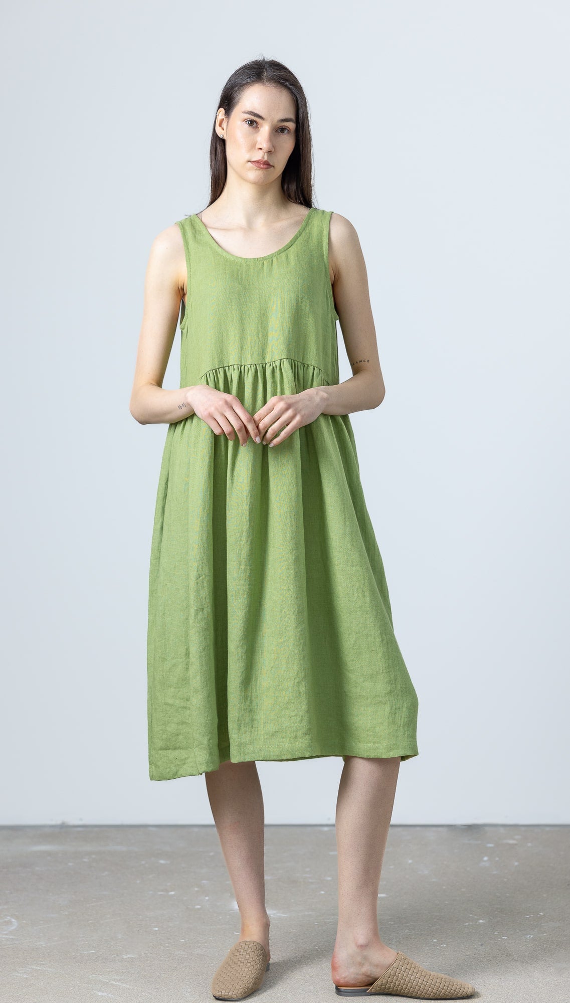 MinimalisticLinen sleeveless green linen dress in midi length, handmade for timeless comfort.