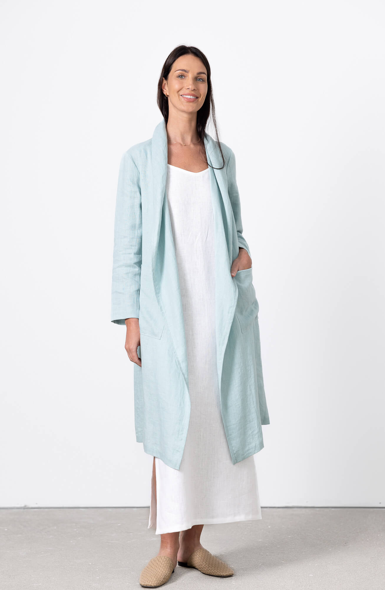 woman wearing mint green linen long cardigan with white dress