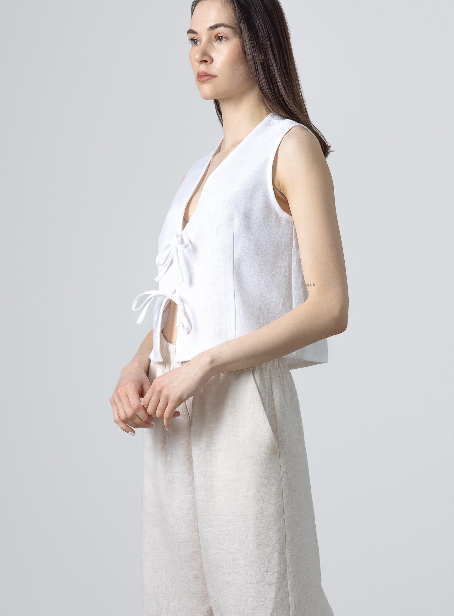 Sleeveless linen waistcoat paired with breathable linen pants for a timeless minimalist look