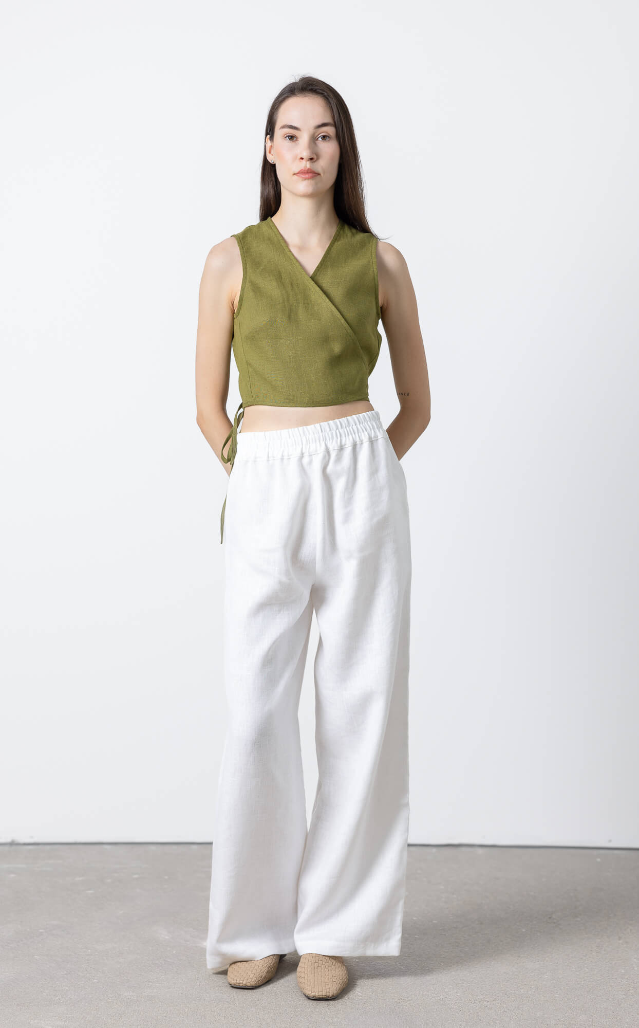 Women's sleeveless cropped linen wrap blouse with side tie fastening, breathable OEKO-TEX® certified linen top designed for effortless minimalist styling
