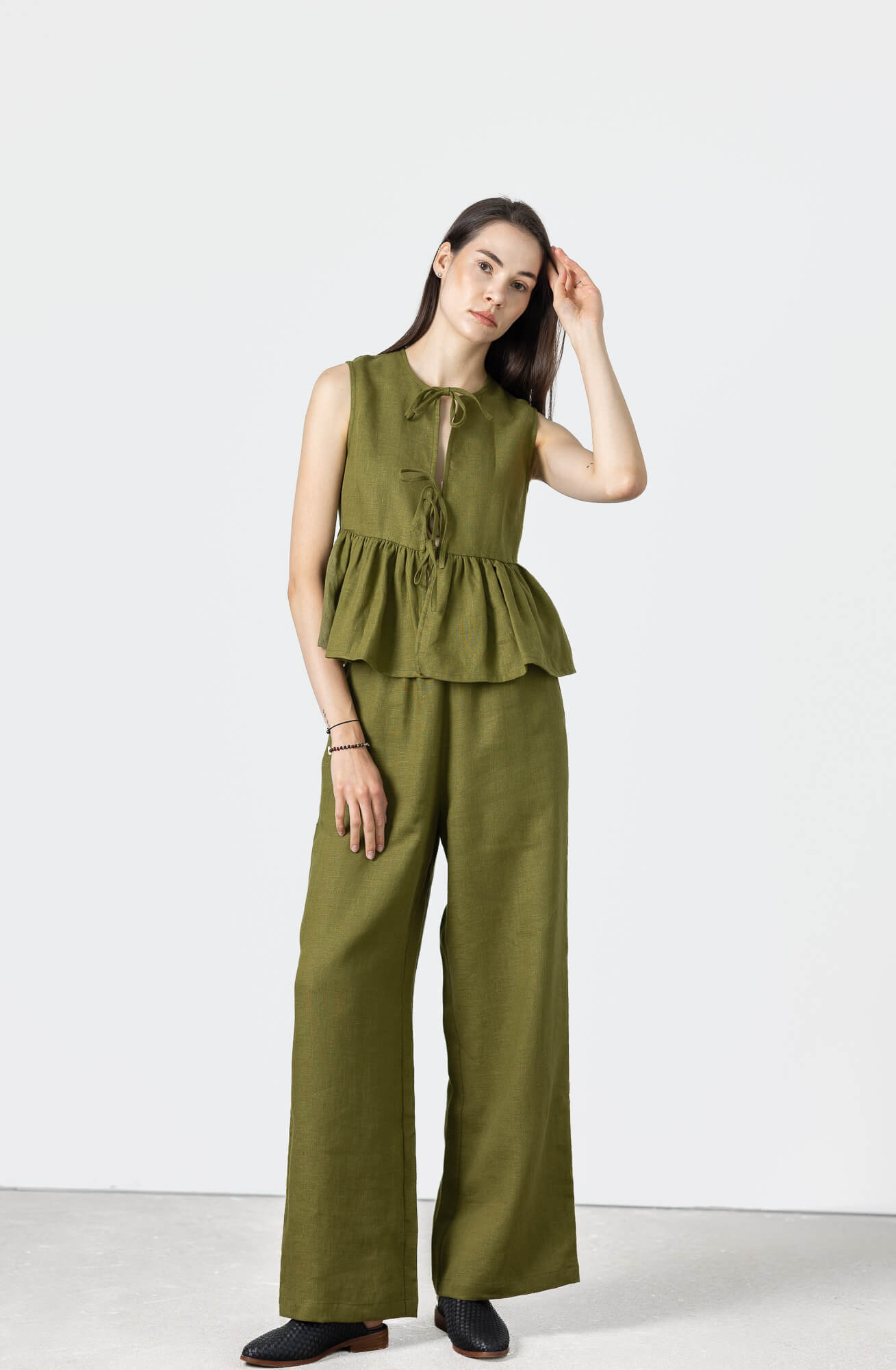 Women's sleeveless linen tie front vest with a relaxed fit and softly gathered hem