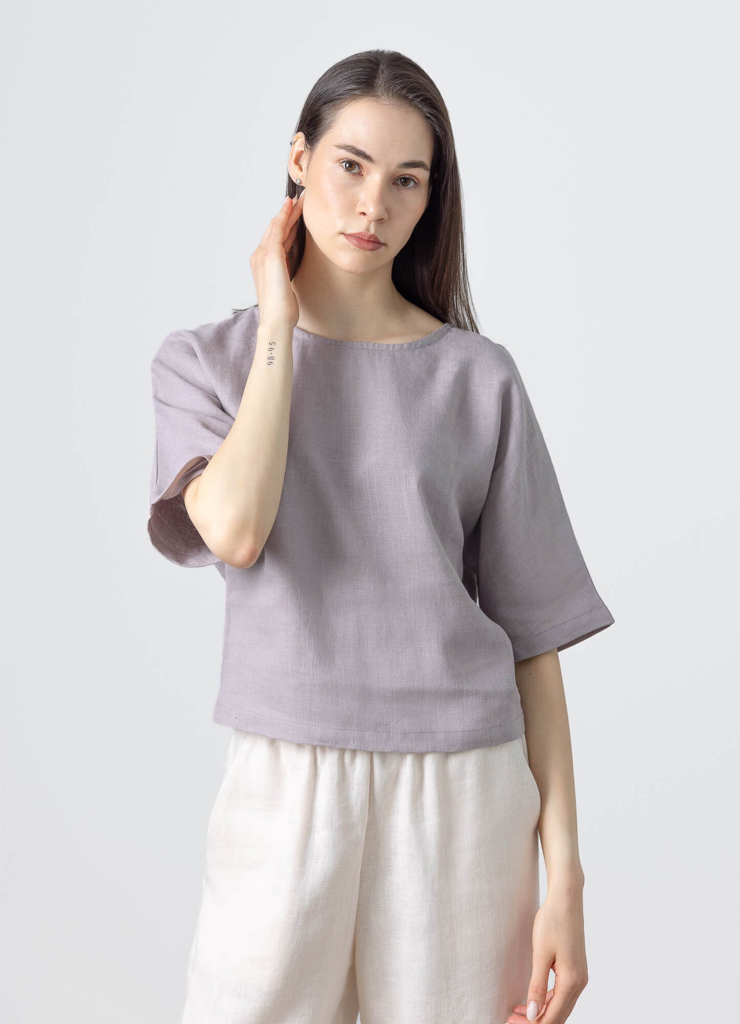 Casual women's linen crop top featuring wide short sleeves and a comfortable relaxed fit