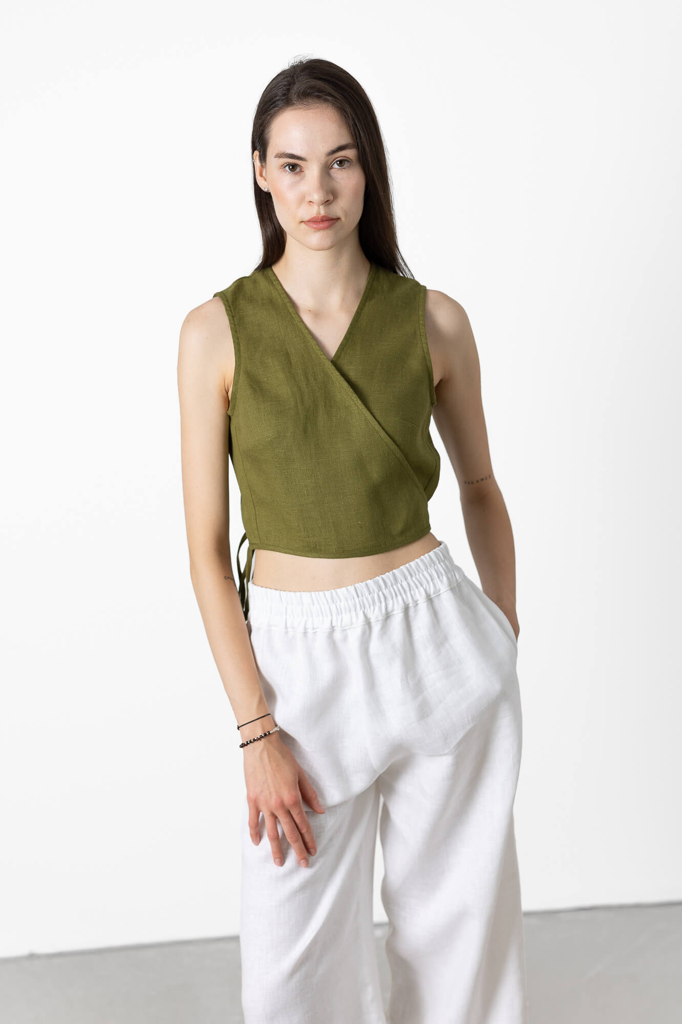 Breathable women's linen wrap crop top with adjustable side tie, sleeveless minimalist blouse made from OEKO-TEX® certified linen