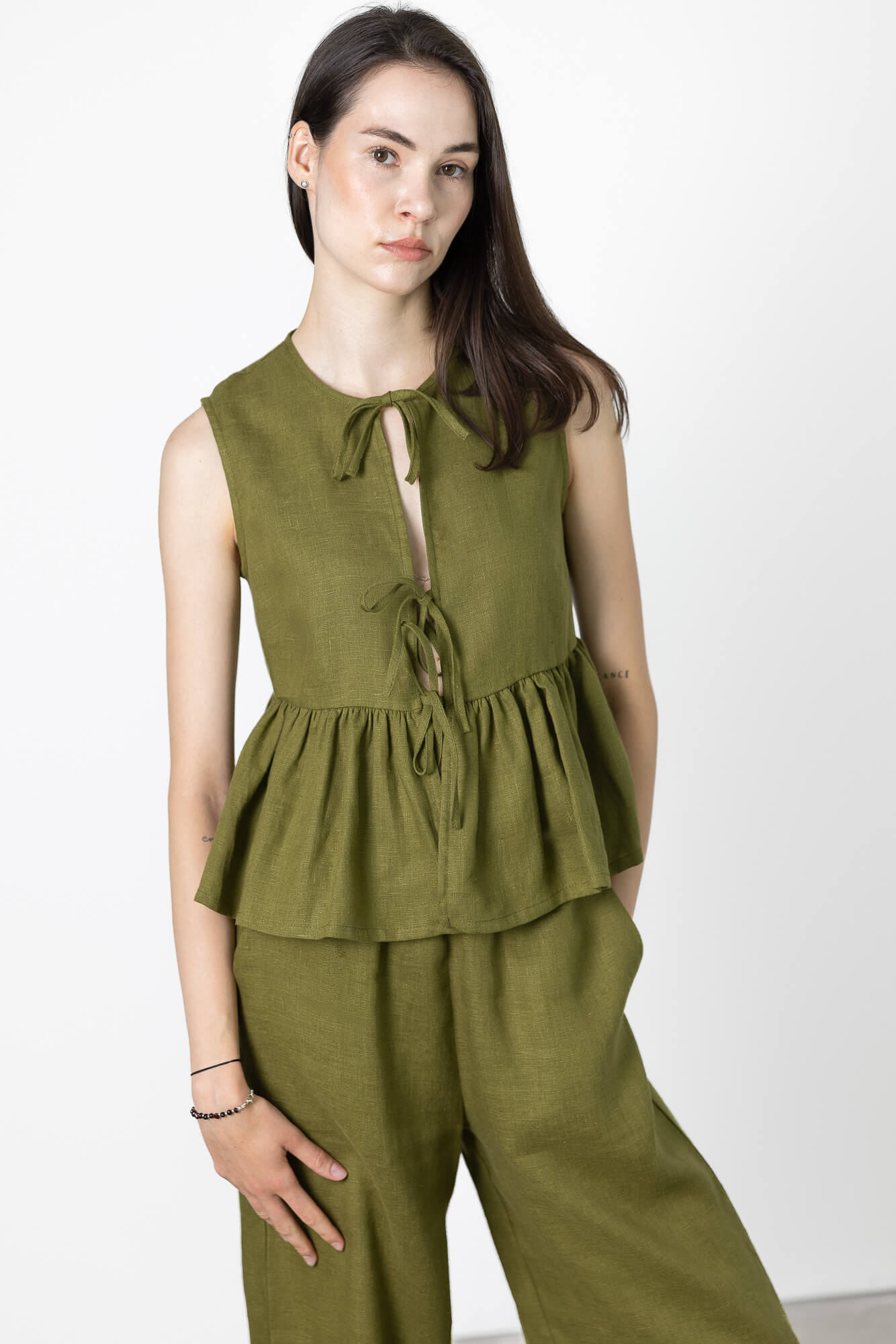 Handmade women's sleeveless linen vest with adjustable tie front and gathered hem crafted from breathable European linen