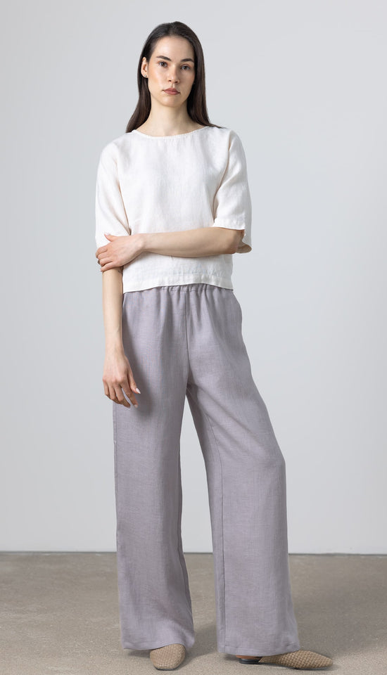    Women’s minimalist linen outfit featuring Petite Women Linen Pants Rosaire, wide leg design in soft natural grey linen
