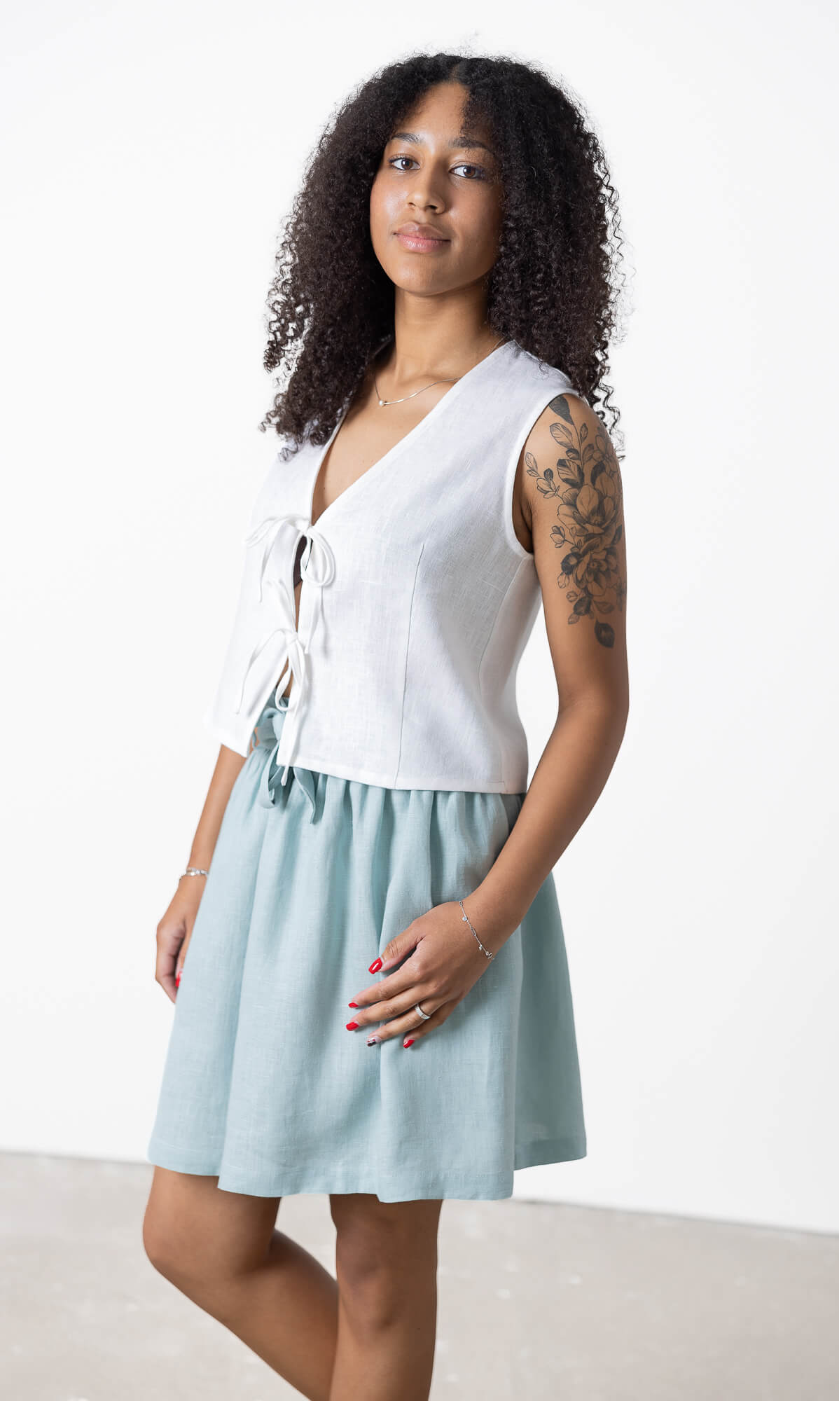 Light blue linen mini skirt with relaxed A-line silhouette