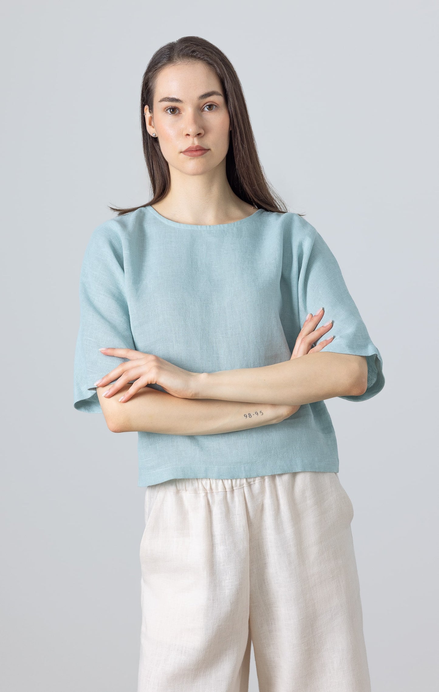 Linen crop top for women in light blue – minimalist short-sleeve blouse in natural fabric