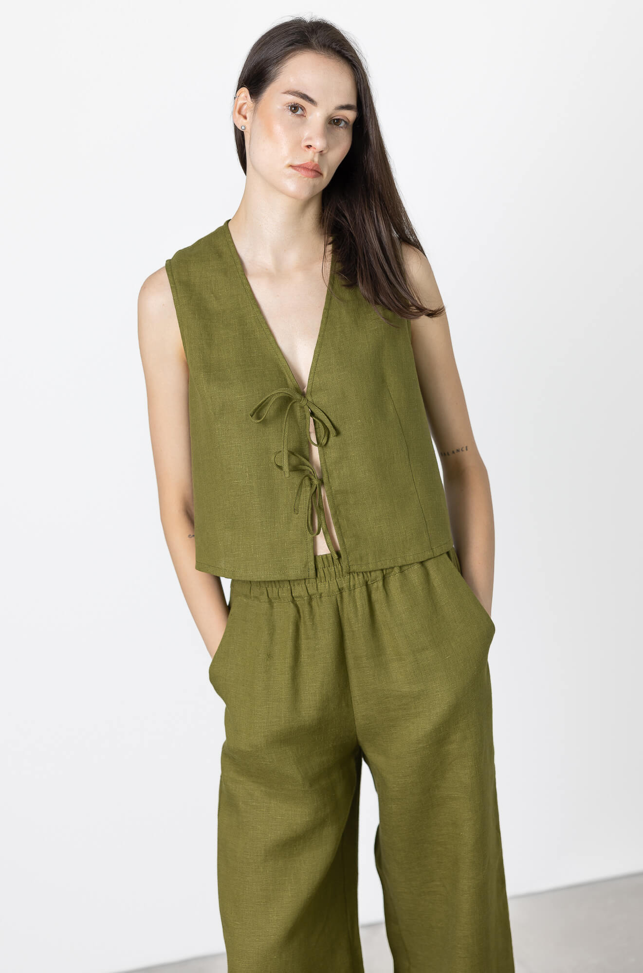 Linen vest with clean minimalist styling and front ties
