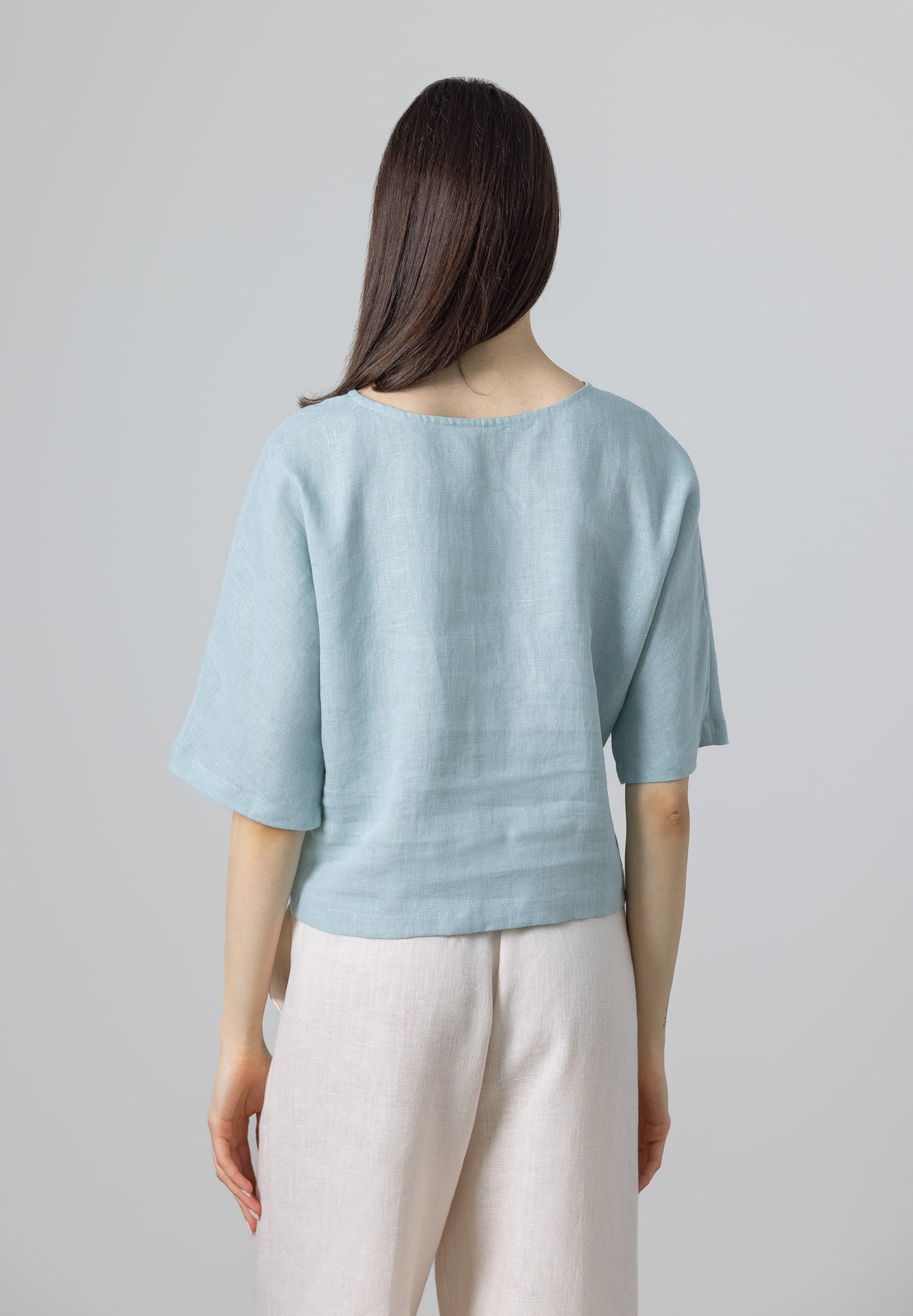 Rear view of linen cropped top – light blue blouse for women in breathable fabric
