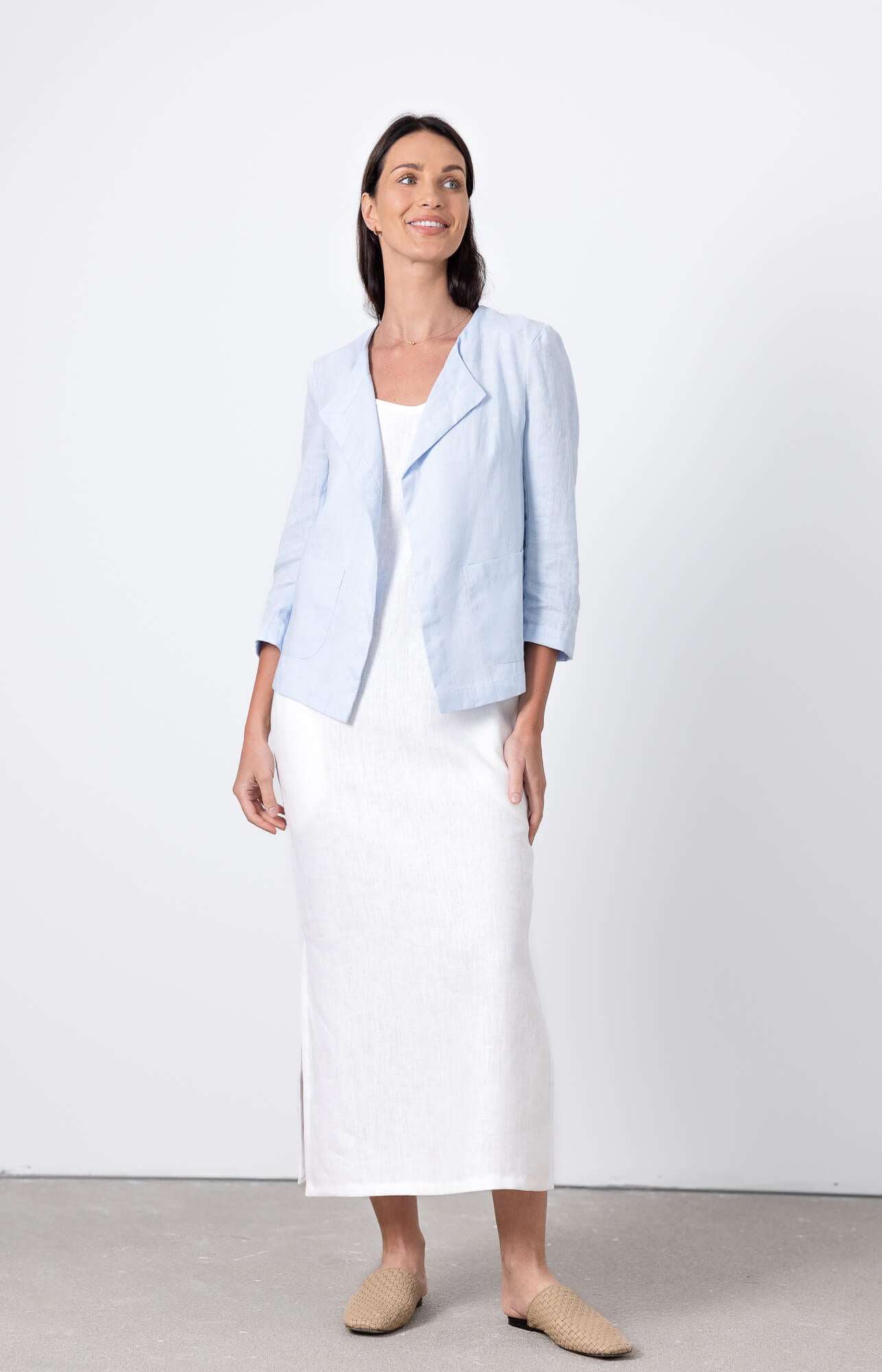 Women wearing classic light blue linen jacket minimalist women linen blazer outfit