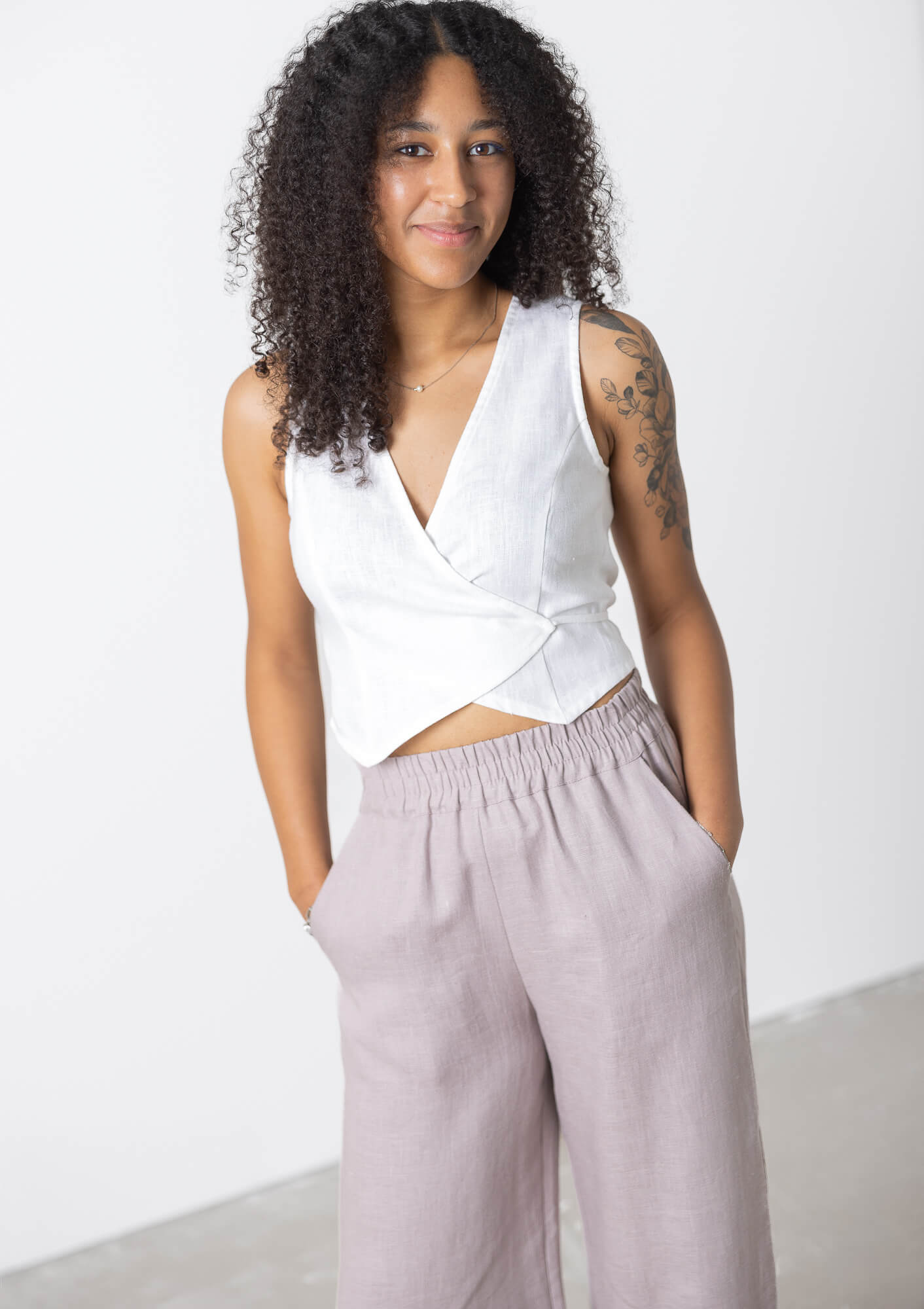 Women's minimalist linen wrap crop top with a lightweight sleeveless design